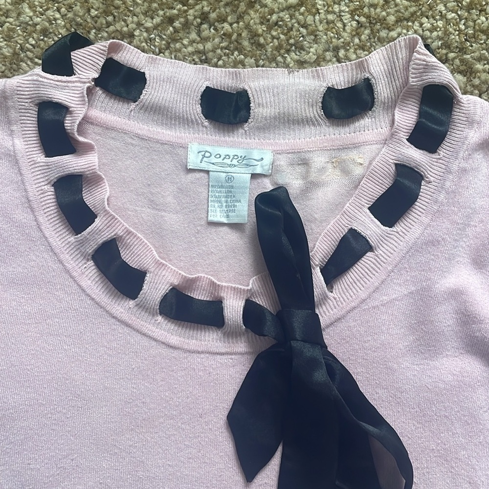 Pink sweater with black tie along neckline - Picture 2 of 11